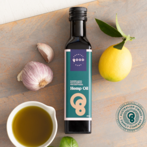 Good Country Hemp, hemp seed oil bottle, with open bowl of hemp seed oil next to the bottle.